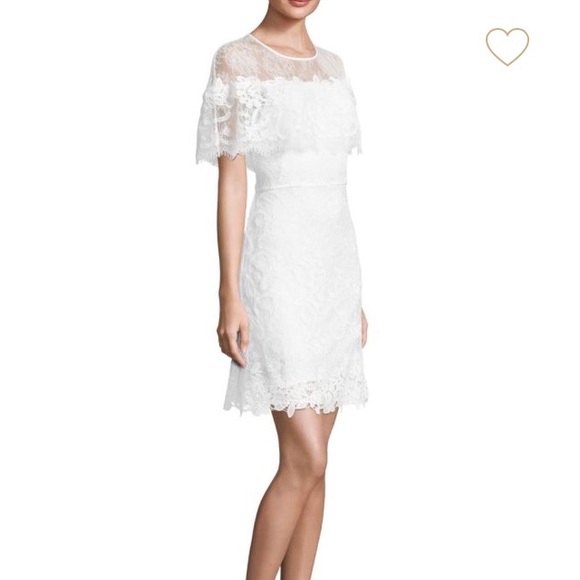 white dress with cape overlay